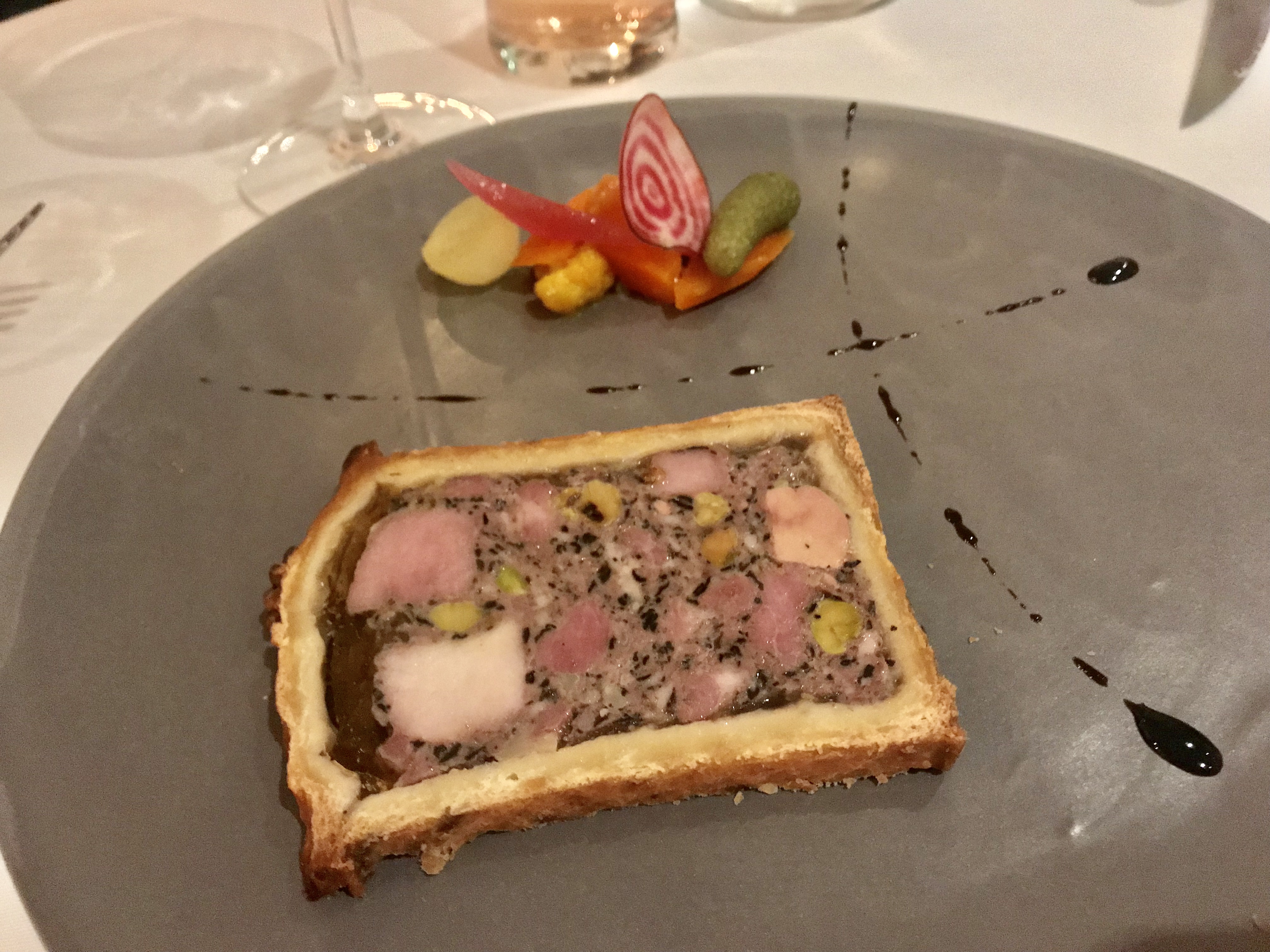 Pâté croûte, pork, veal, foie gras, pistachios, mushrooms, pickled vegetables by Philippe Mouchel
